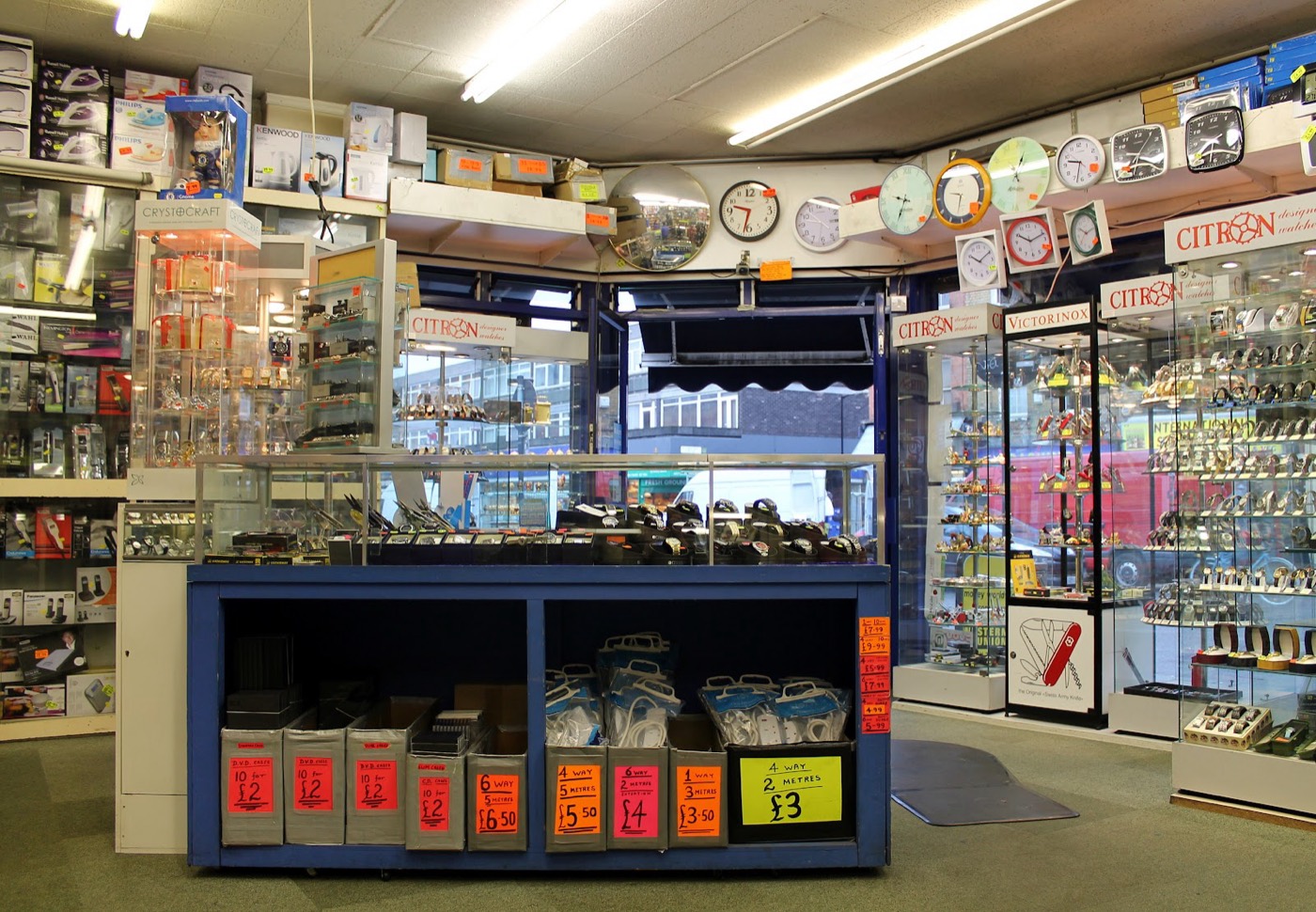 Inside Raj Enterprises, with clocks, watch cabinets and the service counter