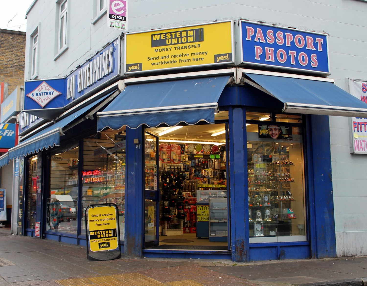 The Raj Enterprises shopfront on Bethnal Green Road, with the Watch & Battery Centre sign