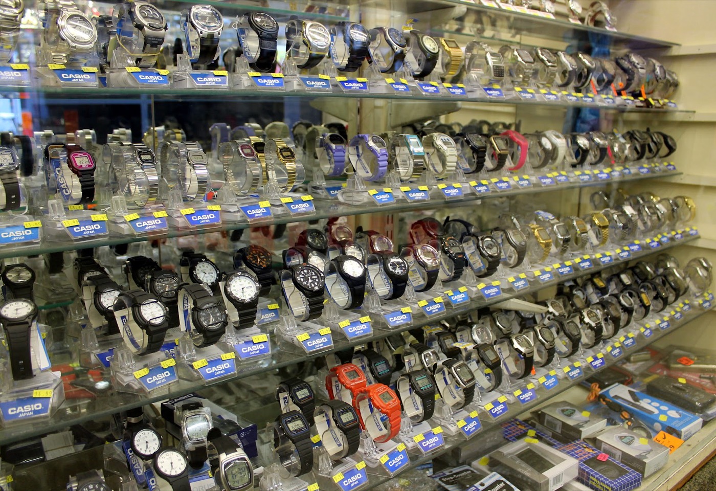 Shelves of Casio and digital watches on display inside Raj Enterprises, Bethnal Green
